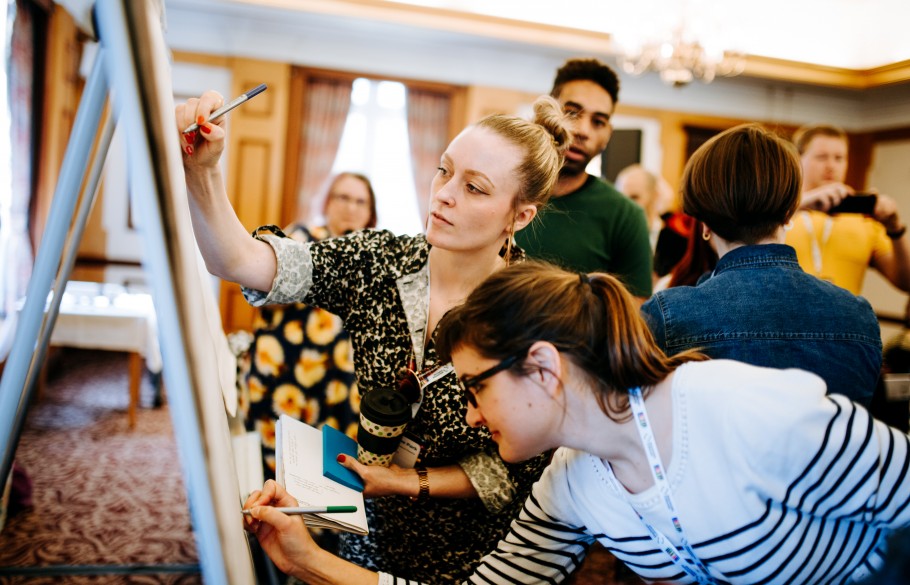Picture of participants of IETM Hull 2019 writing on a flip chart