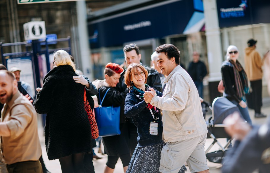 Picture of participants of IETM Hull 2019 waltzing in the streets of Hull